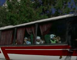 Kids, boys and girls inside a bus to go on beach (1)