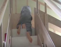 Boy in diaper under pyjama in upstairs