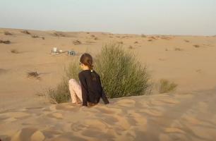 Boy and girl in the sand at desert (2)