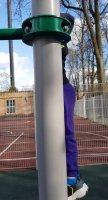 Similar boy kid wearing purple pant at playground with older sister