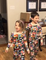 3 kids (2 boys and her sister girl) in diaper in pajama pant X-mas