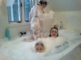 Three girls bubble tub party