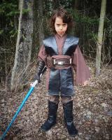 Young cosplayer in leather gloves