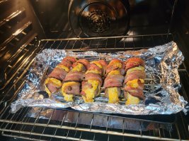 Stuffed Brats wrapped in Bacon