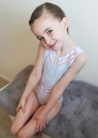 Cute gymnast girl in leotard