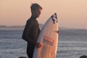 surfer boys in rubber lycras