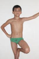 Little asian boy in green briefs