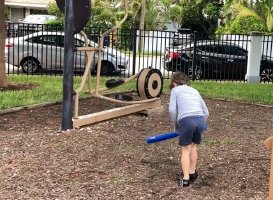 Kid boy wearing dark blue short pant in playground 5