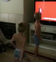 Two boys dances in front of the tv (2)