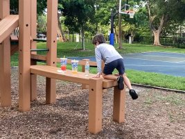 Kid boy wearing dark blue short pant in playground 4