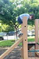 Kid boy wearing dark blue short pant in playground 3