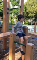 Kid boy wearing dark blue short pant in playground 2