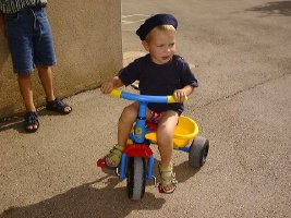 little boy on trike